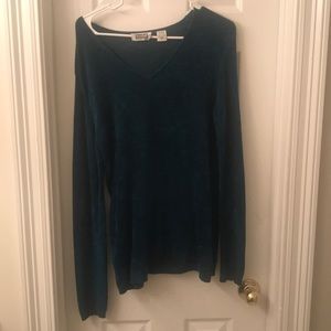 Warm teal sweater.